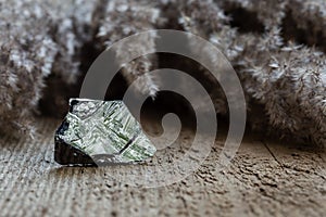 Piece of raw polycrystalline silicon on wood photo