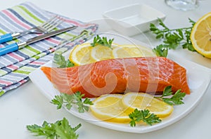 Piece of raw salmon on a plate