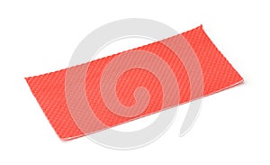 Piece of red plastic perforated packaging underlayment