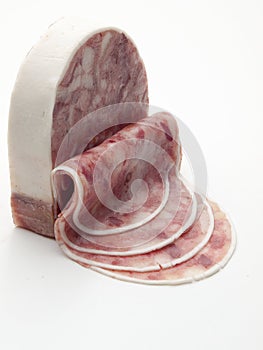 Piece of sausage of wild boar meat cut into slices. photo