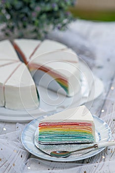 piece of slice rainbow crepe cake