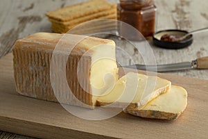 Piece and slices of traditional Italian Taleggio dop photo