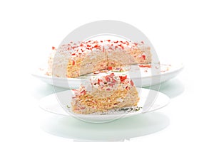 Piece of snack cake stuffed with crab sticks in a plate