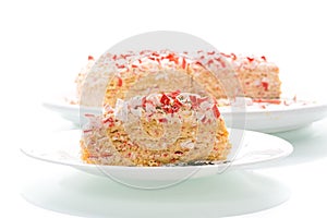 Piece of snack cake stuffed with crab sticks in a plate