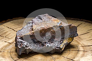 A piece of solid hematite with its rough texture. The natural raw stone of great healing power photo