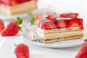 Piece of Strawberry Cake on a white plate photo