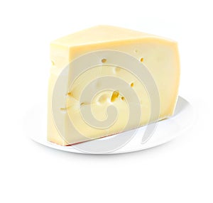 Piece of Swiss cheese on white plate on white background
