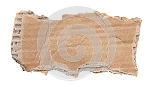 A piece of textured packaging cardboard. Piece of torn cardboard with copy space. Brown wrapping vintage paper, isolated top view