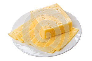 Piece and thin slices of cheese in glass plate isolated on white