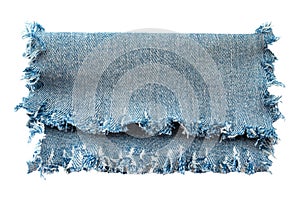 Piece of torn denim on a white background. Denim texture