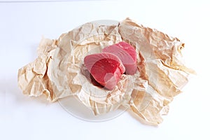 Piece of tuna on white background. natural omega. Isolated object.