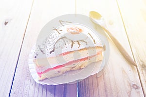 Piece of Vanilla Cake on wood table