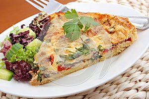 A piece of vegetable quiche photo