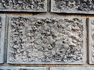 Part of wall made from solid granite rock