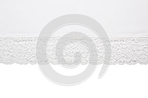 Piece of white fabric with lace isolated on white