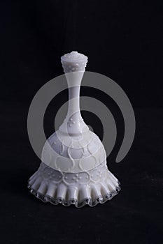 Hand blown white glass bell photo