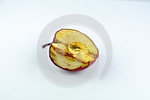 Piece of withering apple half, not fresh crumple fruit, isolated object