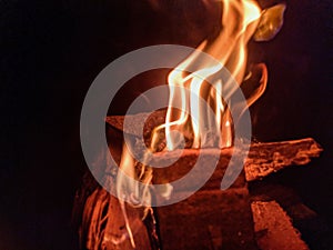 a piece of wood that is burned and becomes a fire