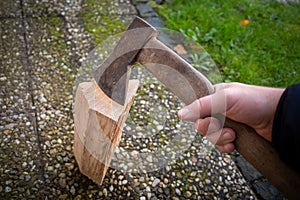 a piece of wood is split with an axe