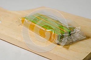 A piece of yellow-green lapis legit cake