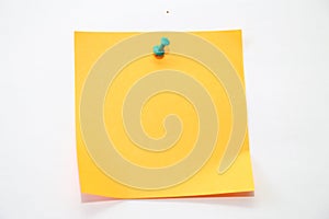 Piece of yellow paper template background with green pin