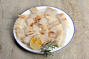 Pieced of sea fish filet on a white plate