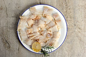 Pieced of sea fish filet on a white plate