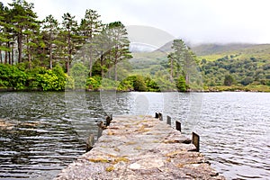 Pieceful view of the stone jetty on the lake