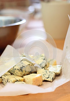 Pieces of a blue cheese on a kitchen