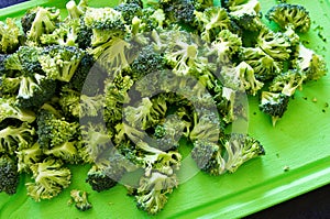 Pieces of broccoli on cutting board