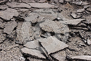 Pieces of Broken asphalt. Dismantling road surface