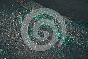 Pieces of broken green tinted car glass