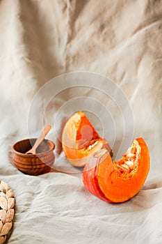 Pieces of butternut pumpkin on an autumn background. Copy space.Traditional fall and winter concept