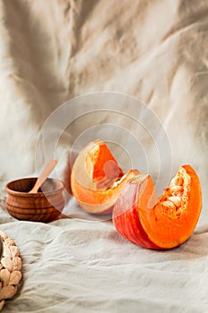 Pieces of butternut pumpkin on an autumn background. Copy space.Traditional fall and winter concept