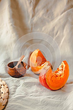 Pieces of butternut pumpkin on an autumn background. Copy space.Traditional fall and winter concept.Toning