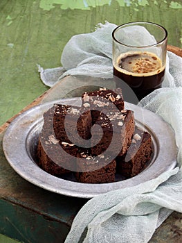 Pieces of cake chocolate brownies on wooden background. Homemade baking. Copy space