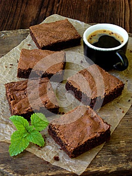 Pieces of cake chocolate brownies on wooden background. selective focus.