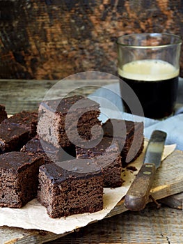 Pieces of cake chocolate brownies on wooden background. selective focus.