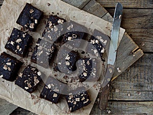 Pieces of cake chocolate brownies on wooden background. selective focus.