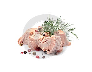 Pieces of canned tuna with dill and pepper