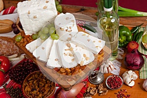 Pieces of cheese on a knife board