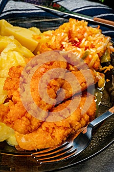 Pieces of chicken fried in breadcrumbs photo
