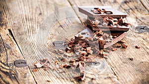 Pieces of chocolate bow wooden board.