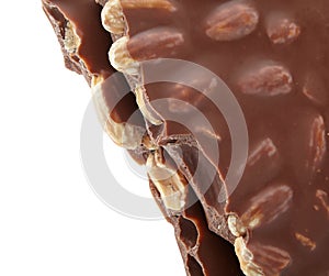 Pieces of chocolate with nuts, close-up delicacy