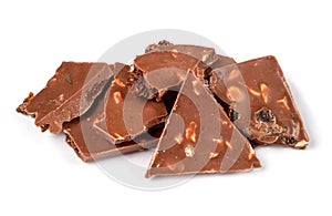 Pieces of chocolate with raisins and nuts.