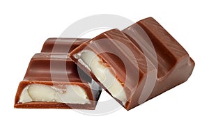 Pieces of chocolate with soft milk filling on a white background. Chocolate bar. Pastry