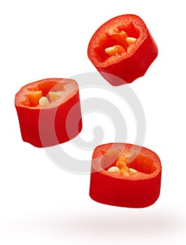 Pieces of chopped red chili pepper vegetable isolated on white