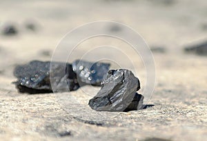 Pieces of coal lying on the road