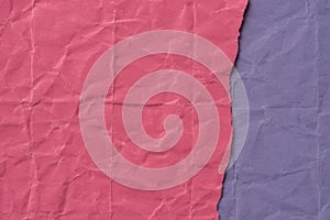 Pieces of creased pink and violet paper background texture
