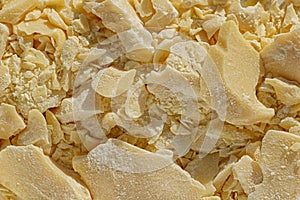 Pieces of crushed cocoa butter, chocolate ingredient close-up